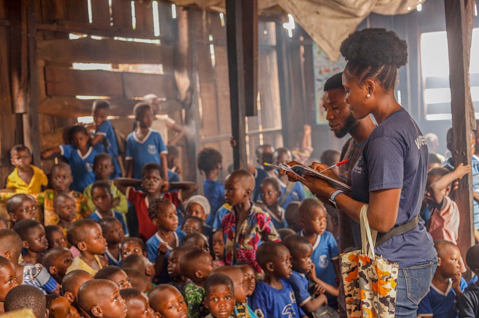Volunteers teaching and serving children